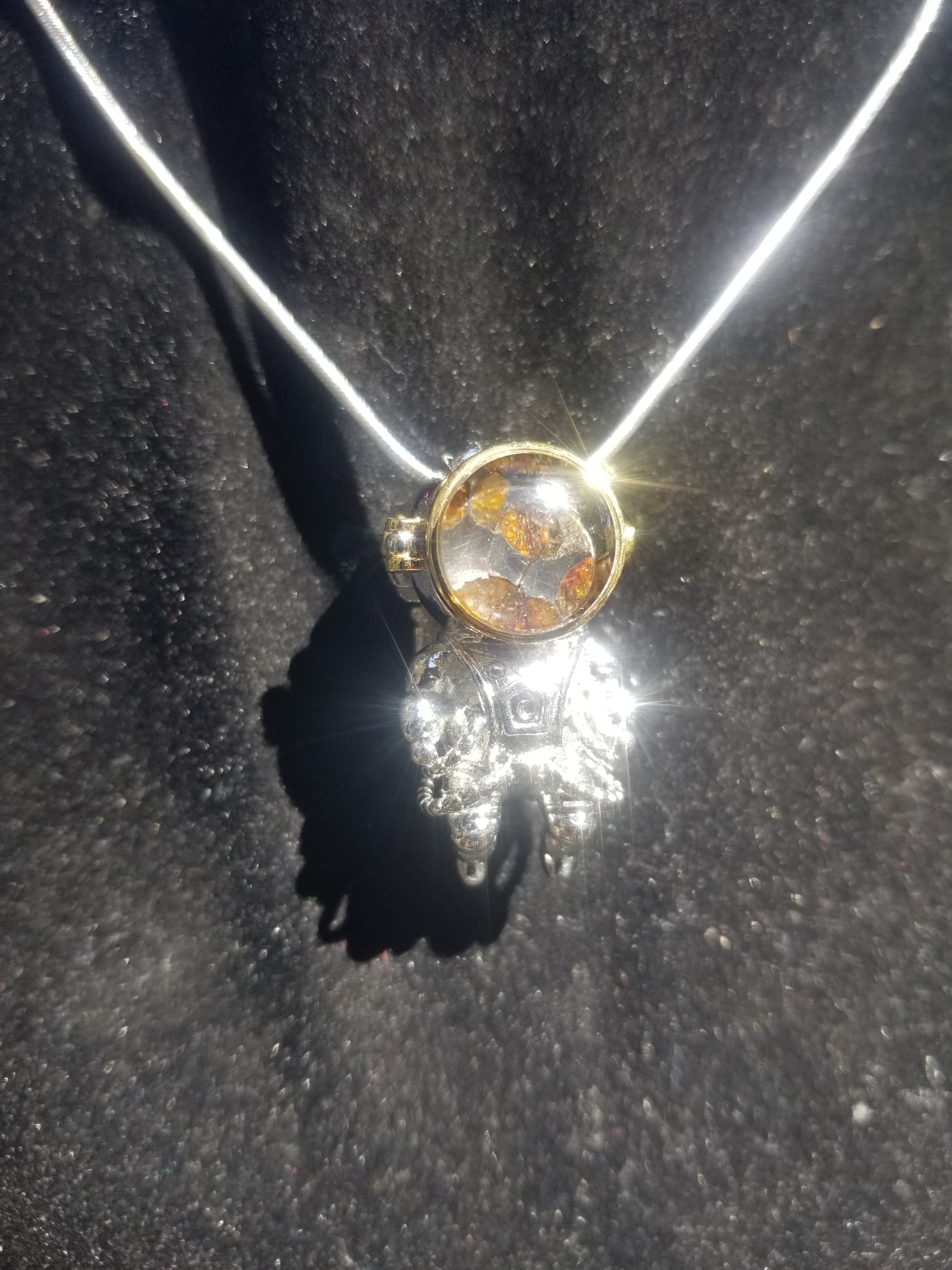 Admire Pallasite Olivine Meteorite Presented in Face Shield of Spaceman Unique Pendant - Stainless Steel